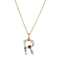 Macro detail of gold letter R pendant with multi-colored gemstone inlay and chain - Letter R
