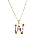 Detail of gold necklace featuring a large W pendant inlaid with colorful round gemstones - Letter W