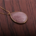 Elegant gold-tone teardrop pendant necklace featuring a polished pink gemstone inlay - Pink Crystal Water Drop