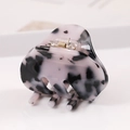Close-up of acetic acid hair claw clip featuring black and white marble patterns - S136-7 Bow Black & White Pattern