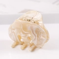 Detailed side view of a large cream marble acetate hair claw clip with golden metal spring - S136-3 Bow Cream Marble