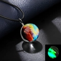 Macro shot of glass galaxy orb pendant showing glowing luminous effect in the dark - Luminous Style 15