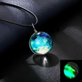 Detail of double-sided galaxy glass orb pendant showing luminous green glow in dark - Luminous Style 9