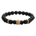 Pulsera de cuentas de piedra negra mate de 8mm con calavera dorada y cuentas de textura - Dorado