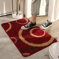 Red rectangular plush entryway rug with beige spiral patterns on tiled floor - 40x60cm / Wealth Circles