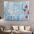 Detail of Christmas tapestry featuring Merry Christmas text over a sofa in a modern room - Light Blue Wood Grain Xmas