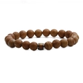 Macro detail of natural stone mood beads with brown patterns and center barrel bead accent - Jasper