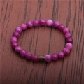 8mm purple mood bead bracelet on a leather background with thermal color changing beads - Rose Purple Stone