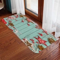 Detailed view of Christmas flannel floor mat with festive patterns on dark wood floor - 40x60cm / Light Blue Wood Reindeer