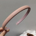 Close-up of pink leather headband featuring fine lychee texture and non-slip inner lining - Pink