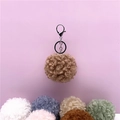 Detailed view showing multiple color options for cute curly fur pom pom keychains and bag charms - 1 Piece / Khaki