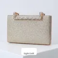 Elegant light gold glitter evening clutch bag with a luxury rhinestone handle - Light gold