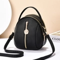 Chic black mini backpack and crossbody bag featuring rose gold zippers and pebble leather - Black
