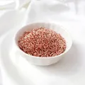 Close-up of rose gold open jump rings in a ceramic bowl for DIY jewelry making - 3mmx0.5mm (50 Pcs) / Rose Gold