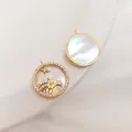Λεπτομέρεια μενταγιόν Αιγόκερως 14K επιχρυσωμένο με φίλντισι και ζιργκόν πέτρες - Αιγόκερως