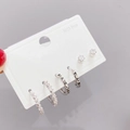 Three-pair minimalist silver stud earring set with zircons and LOVE engraving on white card - White Gold