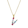 Macro shot of gold V pendant necklace inlaid with multi-color rainbow gemstones - Letter V