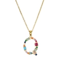 Close-up of golden letter Q pendant with multi-colored gemstones and classic link chain - Letter Q