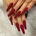 Matte burgundy long coffin press-on nails shown on hands with a marble background - Burgundy