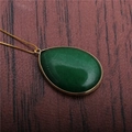 Elegant water drop green stone pendant necklace with gold plated chain on wood background - Green Aventurine Water Drop