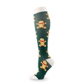 Green Christmas compression socks featuring yellow gingerbread man patterns - Christmas Gingerbread Man