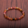 Detailed shot of 8mm matte mood beads bracelet with central color-changing cylinder - Multicolor Matte Stone
