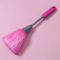 Detail view of pink PP soft bristles and grey anti-slip handle on keyboard dust brush - Pink
