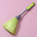 Detail view of dual-color PP bristles keyboard cleaning brush with ergonomic grey and green handle - Green