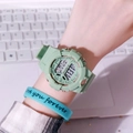 Detail of mint green electronic watch with rose gold bezel and matching love bracelet - Matcha Green