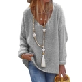 Close-up of grey chunky knit sweater featuring a deep V-neck and wooden star pendant - S / Gray