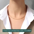 Gold-plated 1.7mm wide cross bead necklace in stainless steel worn by model - Thick Cross Bead Chain 40+5cm / Gold