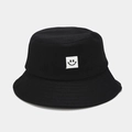 Minimalist black cotton bucket hat with a white square smiley face embroidery patch - Black