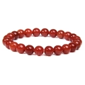 Natural red sunstone beaded bracelet with polished round beads on elastic cord - Red Agate