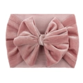 Close-up of pink velvet texture on a baby headband with a large stylish bow detail - Dusky Pink