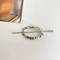 Elegant silver geometric metal hair pin with minimalist twisted oval design on white background - Ellipse / Silver