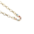 Detailed close-up of a golden chain necklace with a colorful zircon micro-pave letter pendant - Letter U
