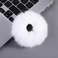 Cute white plush hair scrunchie shown on a desk with a laptop keyboard background - Donut Scrunchie-White
