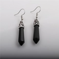 Detail of silver drop earrings with hexagonal black crystal stones on grey background - Black Stone