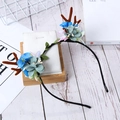 Christmas reindeer antler headband with blue fabric flowers and green leaves on a rack - Blue Gray Flowers Style / 27#