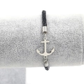 Detail of silver anchor pendant on black woven leather cord bracelet for men and women - Black