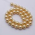 Polished golden glass pearl beads in a spiral arrangement for necklace making - 4mm Straight Hole/Approx 100pcs Per Strand / 296 Yellow