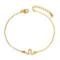 Detail of gold-plated snake pendant featuring white cubic zirconia and green eye stone - Thin Chain Snake Bracelet (XL00102)
