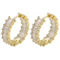 Macro shot of gold hoop earrings with rectangular step-cut clear cubic zirconia stones - Gold White Zirconia