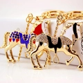 Porte-clés cheval de manège créatifs avec finition dorée et strass brillants pour sacs - Couleur Aléatoire