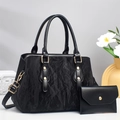Women's black faux leather tote handbag with pleated texture and gold hardware accessories - Black