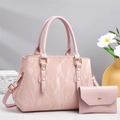 Pink PU leather tote with marble texture and matching wallet shown in lifestyle setting - Pink