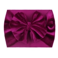 Detailed view of magenta velvet baby headband with a soft large decorative bow - Purplish Red