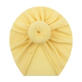 Cute yellow newborn turban hat with donut knot decoration on a plain white background - Yellow