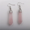 Detailed view of pink hexagonal crystal drop earrings with silver ornate metal hooks - Rose Quartz