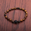 Men's Tiger Eye beaded bracelet with central black lava stone on wooden background - 6*9 Starry Sky Tiger Eye + 10mm Lava Stone